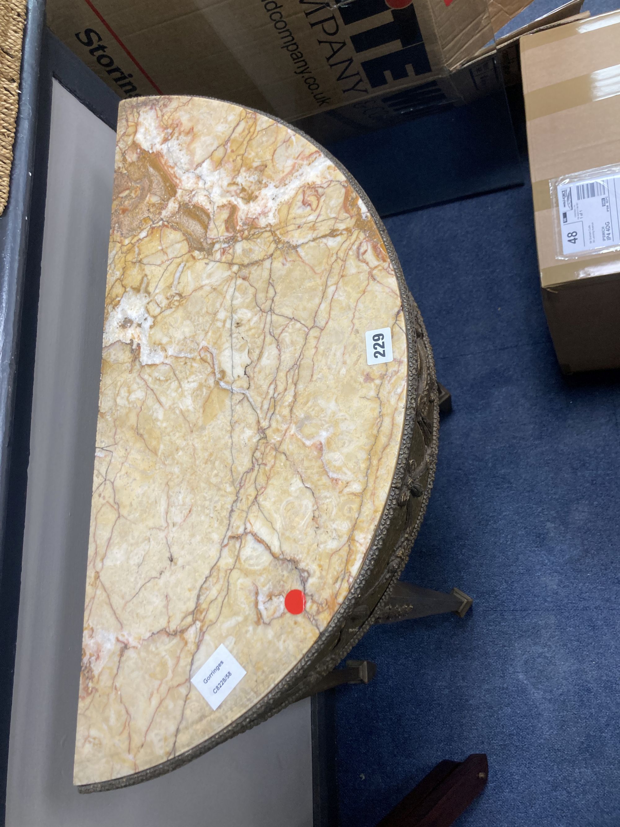 A marble and gilt composition demi lune table, width 70cm, depth 32cm, height 82cm